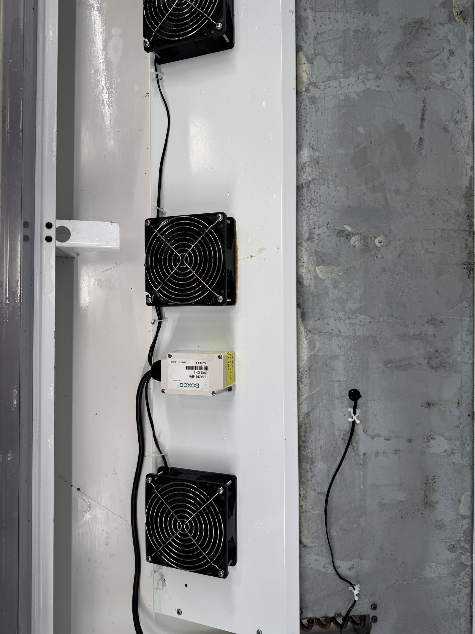 Display fridge drainage — rust runoff & grime cleared — after